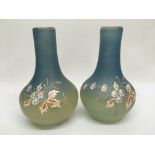 A pair of painted glass vases of baluster form wit