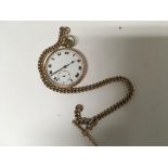 A 9ct button wind pocket watch the enamel dial with Roman numerals and second subsidiary dial with