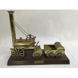 A brass model of Stephenson's rocket engine.Approx 33cm