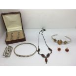 A small collection of silver and amber Art Nouveau