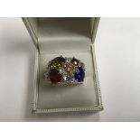 An unusual NVC ring with multicoloured stones. Weight approx 14.5g Size approx U