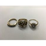 Three 9ct gold rings set with various stones. Sizes approx M & N Weight approx 9g