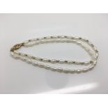 A 9ct gold bracelet with freshwater pearls. Weight approx 6.8g
