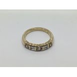 A 14ct yellow gold ring set with baguette and round cut diamonds, approx size N and 4.1g.