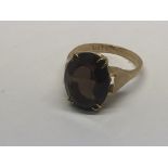 A 9ct Gold ring inset with a smoked quartz stone,