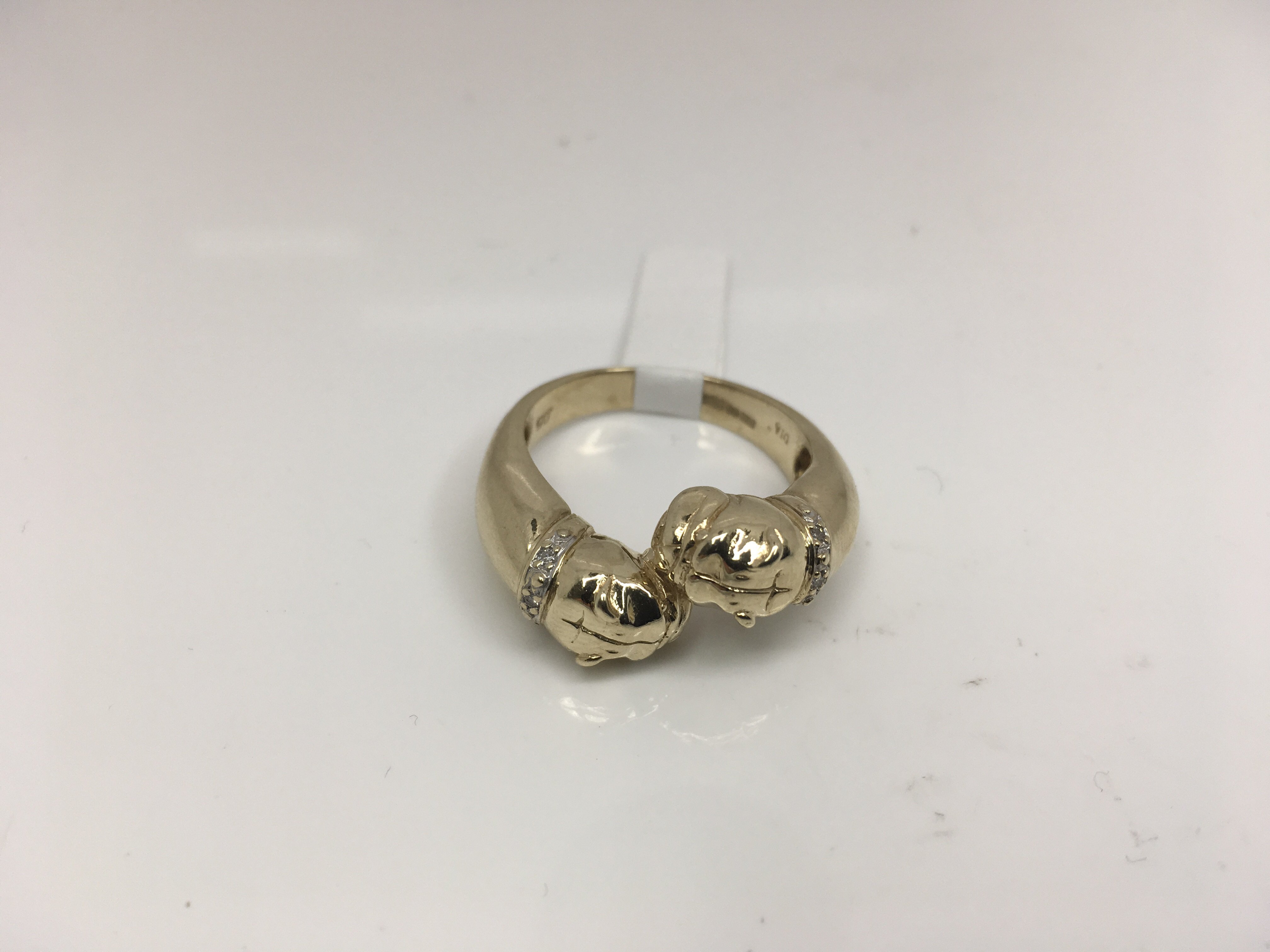 A double headed bull dog ring with diamond set collars. Weight approx 7.85g Size approx U