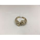 A double headed bull dog ring with diamond set collars. Weight approx 7.85g Size approx U