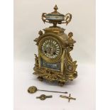 An eight day French gilt metal mantle clock with p