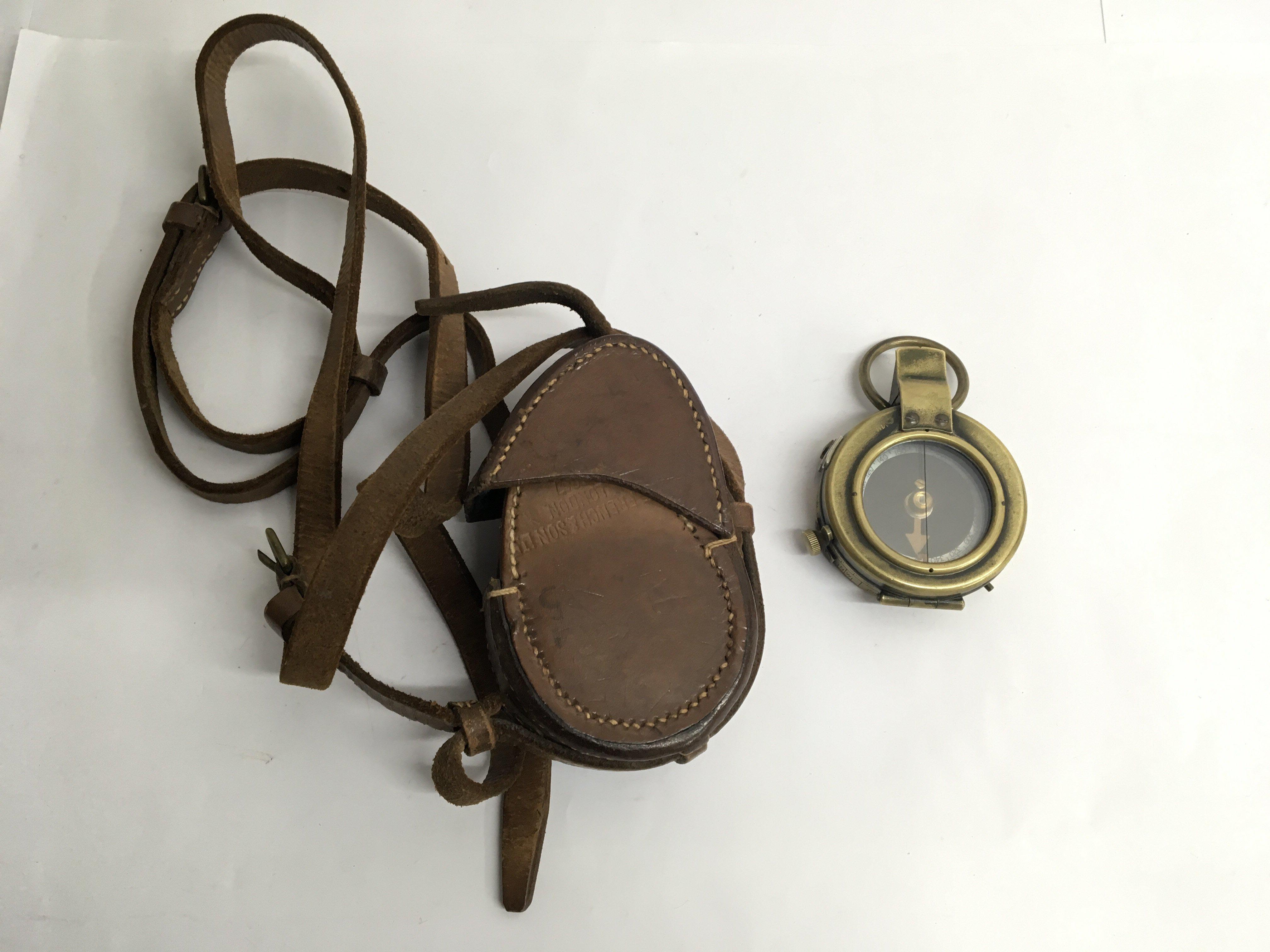 A leather cased military compass dated 1918, made by T.French