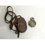 A leather cased military compass dated 1918, made by T.French