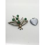 A sterling silver brooch set with jade balls and a heart shaped moonstone pendant
