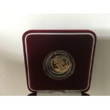 A gold proof half sovereign in a fitted box within