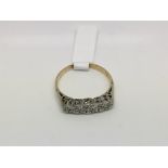 An 18ct gold and platinum five stone diamond ring, approx size O-P and approx 2.5g.
