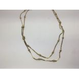 A 9ct gold modern design necklace with two strands
