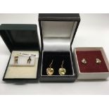 Three pairs of 9ct gold earrings (boxed). Weight approx 2.2g