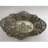 A continental, scalloped shape silver dish with pi