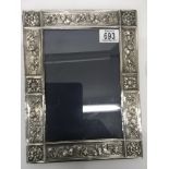 A modern silver photo frame having art and crafts