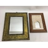 A Grenada decorative mirror and a brass framed exa