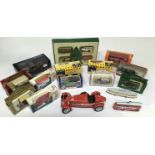 A box containing Vanguards and Matchbox vehicles,