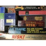 A collection of boxed games including Risk, Scotla