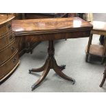 A Georgian style tea table the twin flap top above