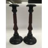 A pair of candlesticks with reeded decoration. Hei