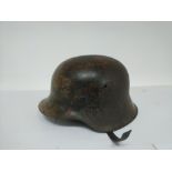 A German M1935 Stahlhelm helmet with serial number