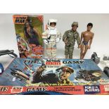 A collection of Action Man figures including a box