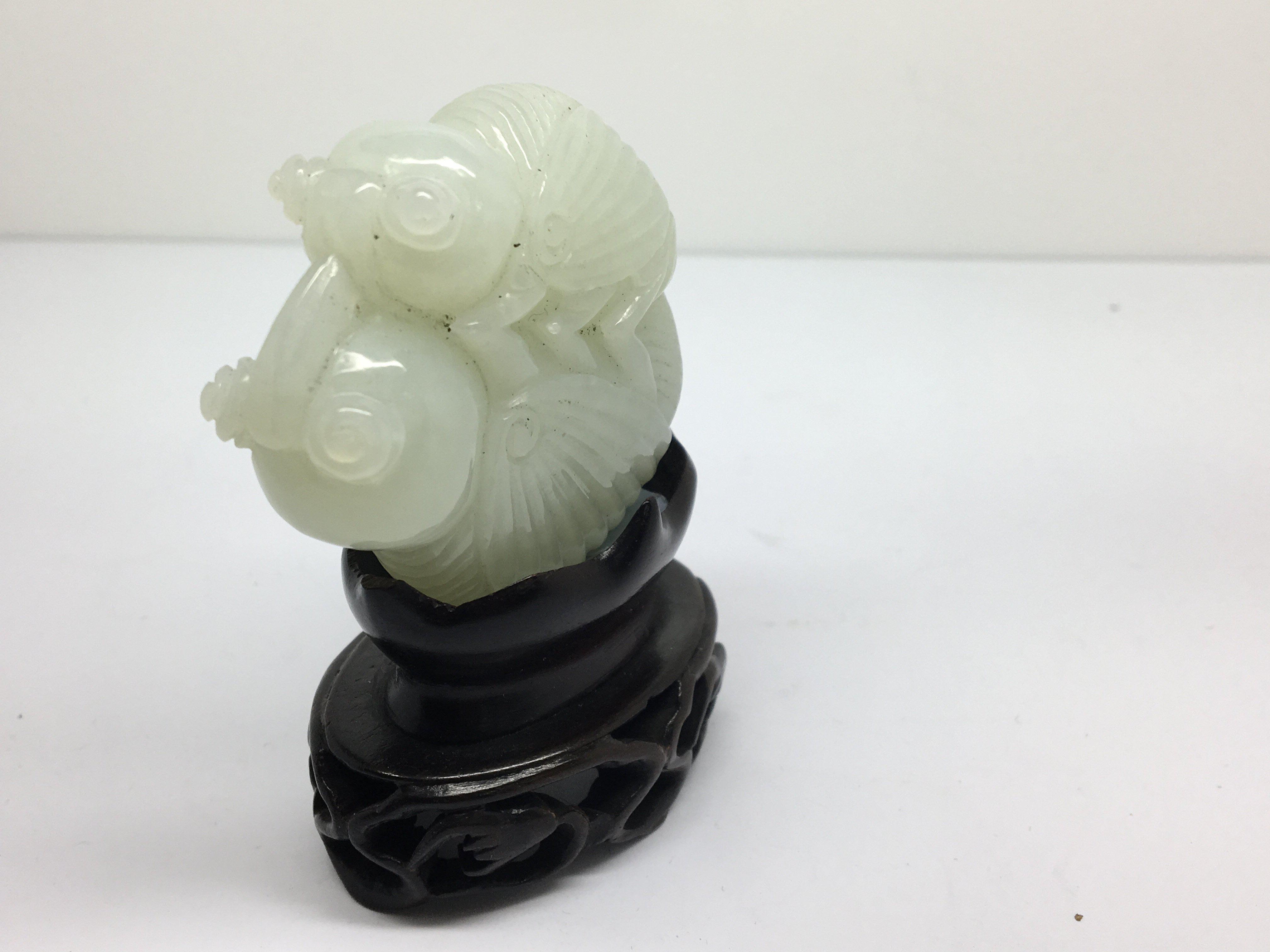 A small carved, light green jade model of a grassh - Image 2 of 3