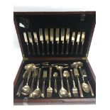 A canteen of bronze and rosewood cased cutlery.