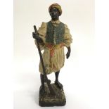 A painted spelter figure of middle eastern warrior