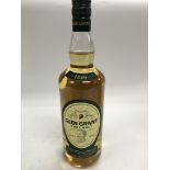 A bottle of exclusive Glen Grant pure malt whisky.