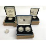 Three cased silver proof coin sets plus a £1 coin