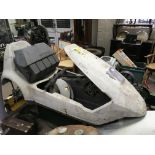 A Sinclair C5 mini electric vehicle in need of ful