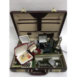 A further suitcase containing costume jewellery an