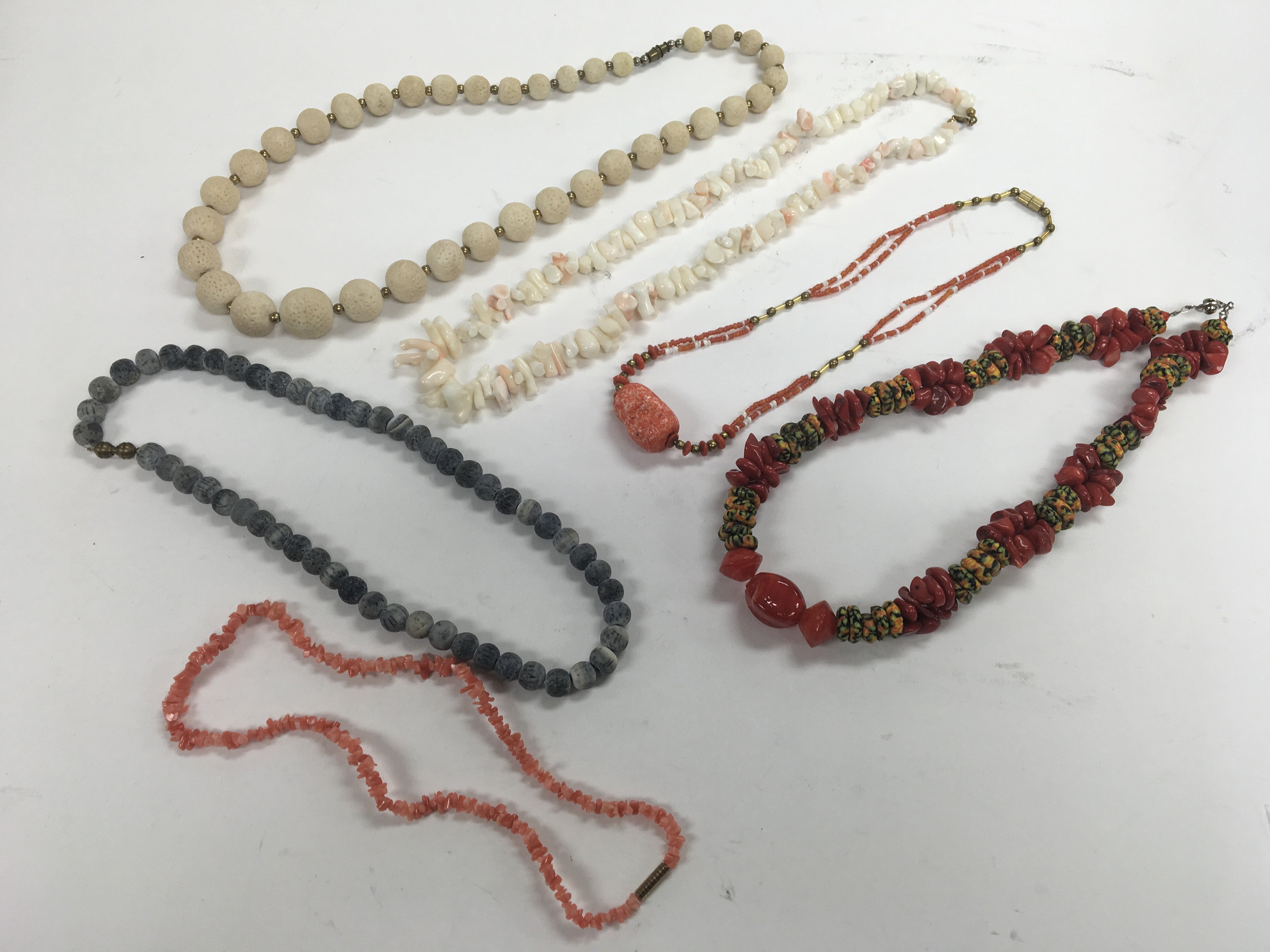 Six coral necklaces.