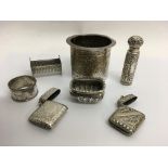 A small group of silver and white metal items incl