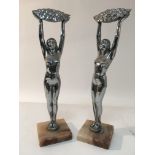 A pair of Art Deco chrome ornaments of nude female