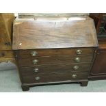 A George III mahogany bureau with fitted interior