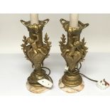 A pair of spelter Art Nouveau table lamps decorate