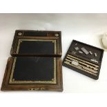 A writing box a/f and a cased engineering tool set