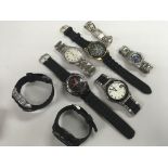 A collection of eight watches including Police & R