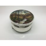 A silver jewellery box with an Arts & Crafts ename