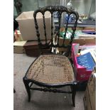 A Victorian ebonised paper mache chair with mother