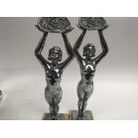 A pair of Art Deco silver plated figures on marble