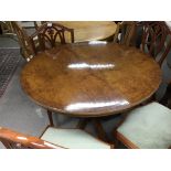 A Mahogany dining table of circular shape and a ma