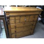A Victorian light oak chest of drawers with a cent
