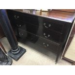 A small walnut chest of drawers fitted with two sh