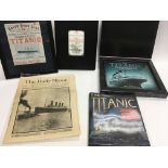 A collection of Titanic ephemera including books,