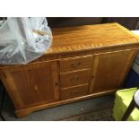 A satin wood sideboard with another small table.